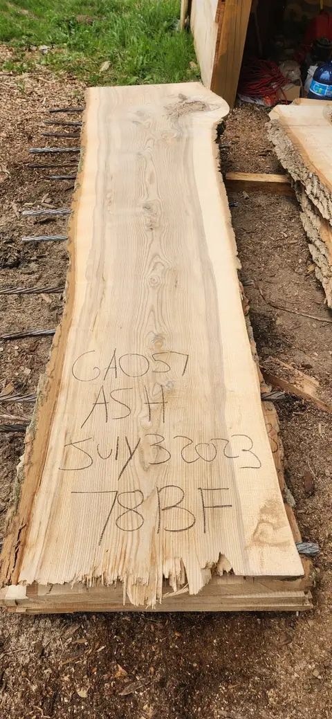 Ash live edge slab with a chalk tag