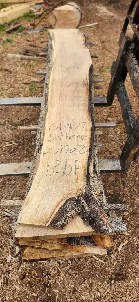Butternut live edge slab with a chalk tag
