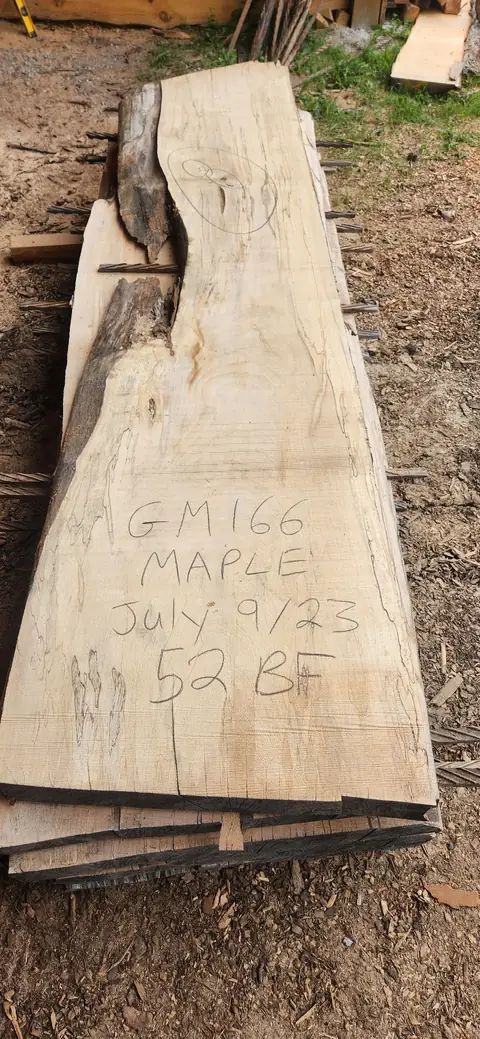 Maple live edge slab with a chalk tag
