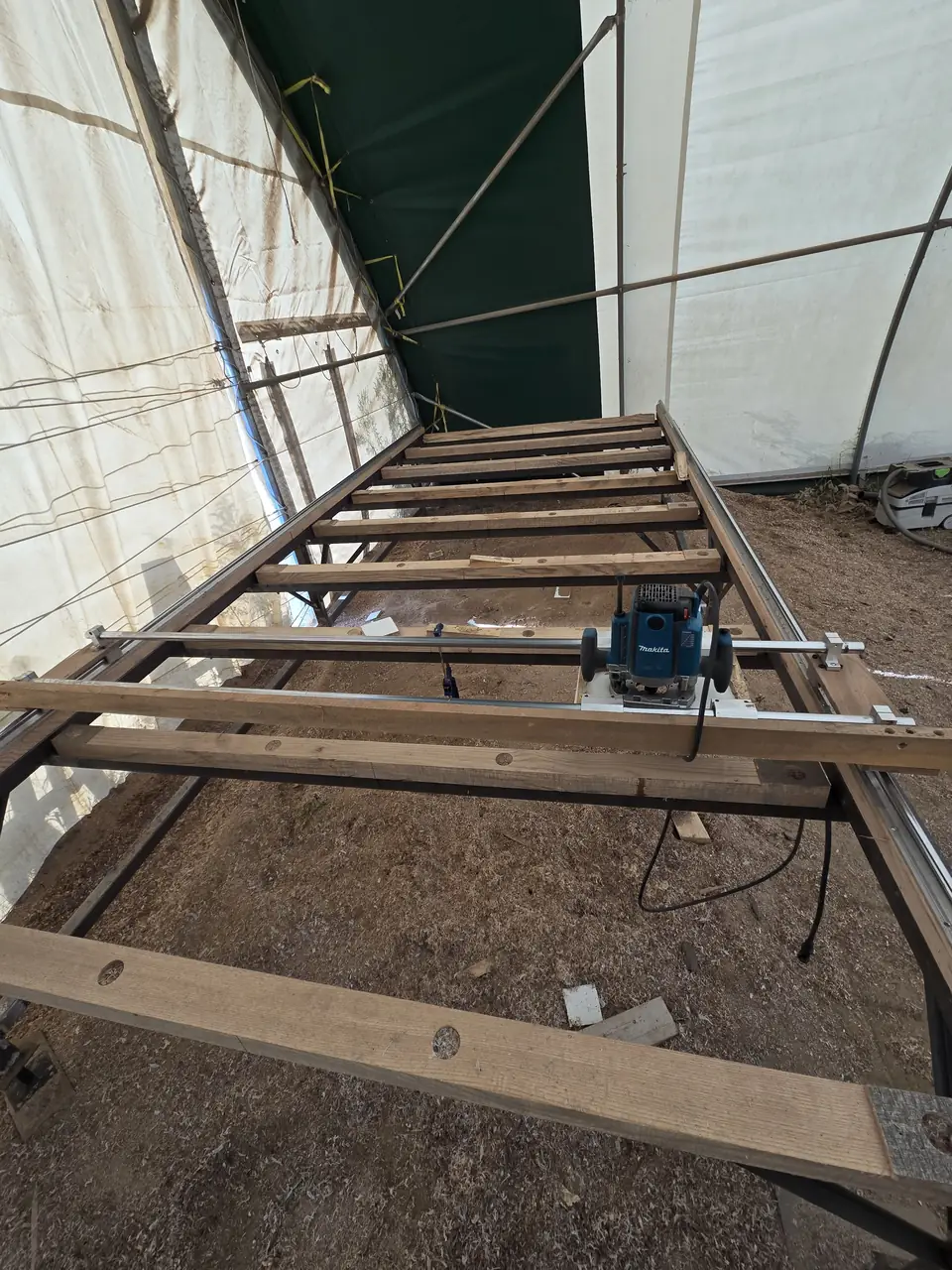 The custom router sled used to flatten wide slabs
